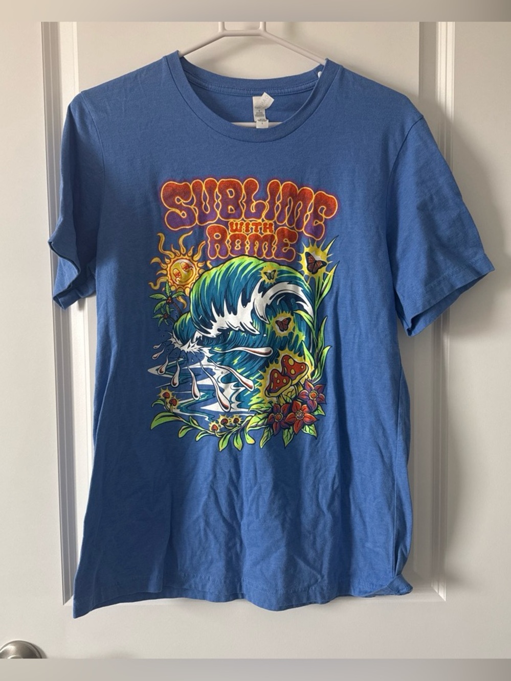 Bella Canvas Blue Graphic Swim Tee with Multicolor Surf Design